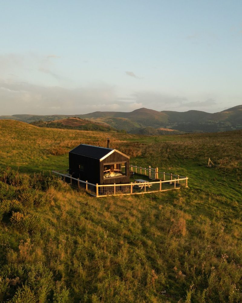 Off-grid cabin overlooking the dee valley at sunset.